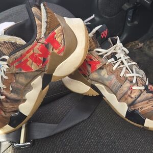 Jordan Brown Camo Sneakers with Red Graphic Accents